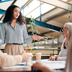 people having a discussion at a table