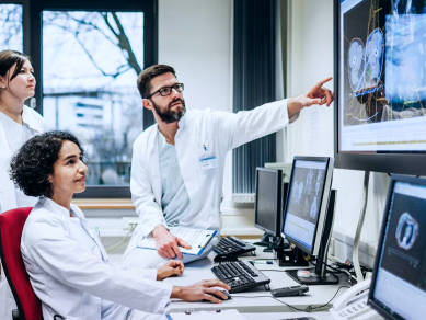 medical professionals viewing medical information on computer screens