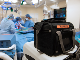 surgeons performing an organ transplant